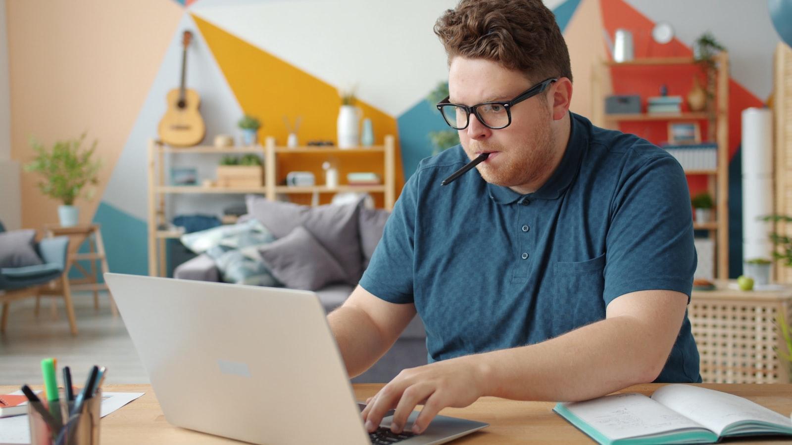 A student working through an online form at a desk