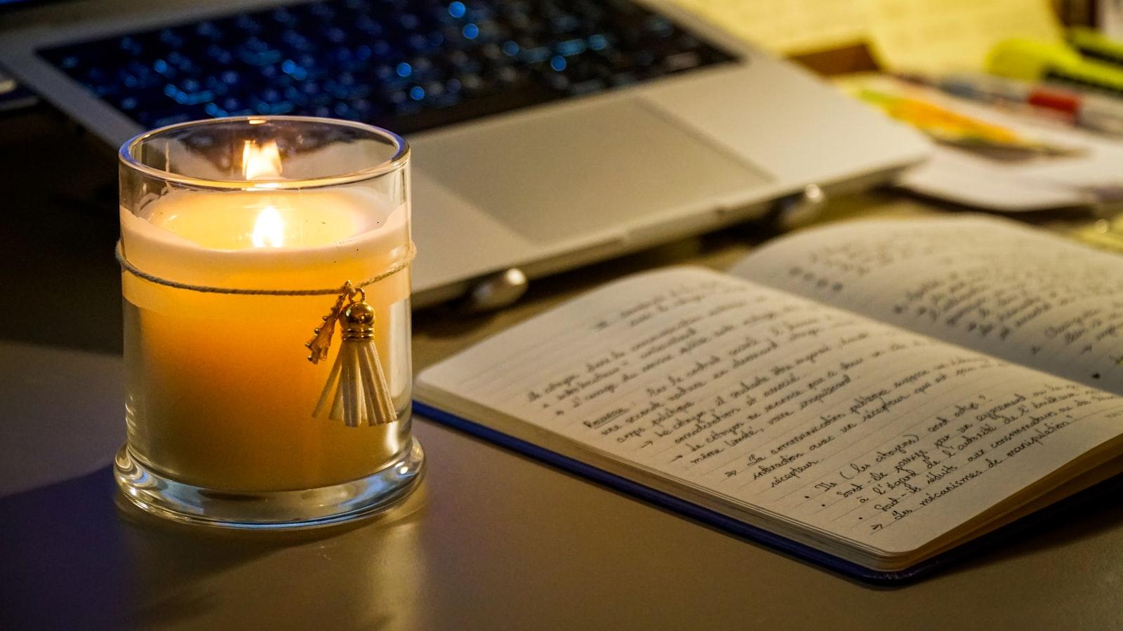 A notebook and laptop arranged for a focused study session